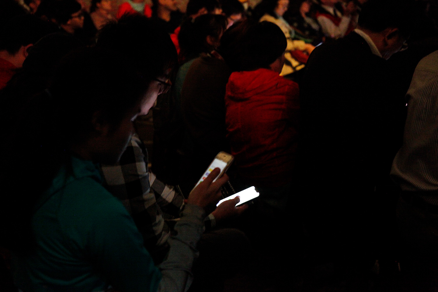 Audience members cast their votes via smart phones.